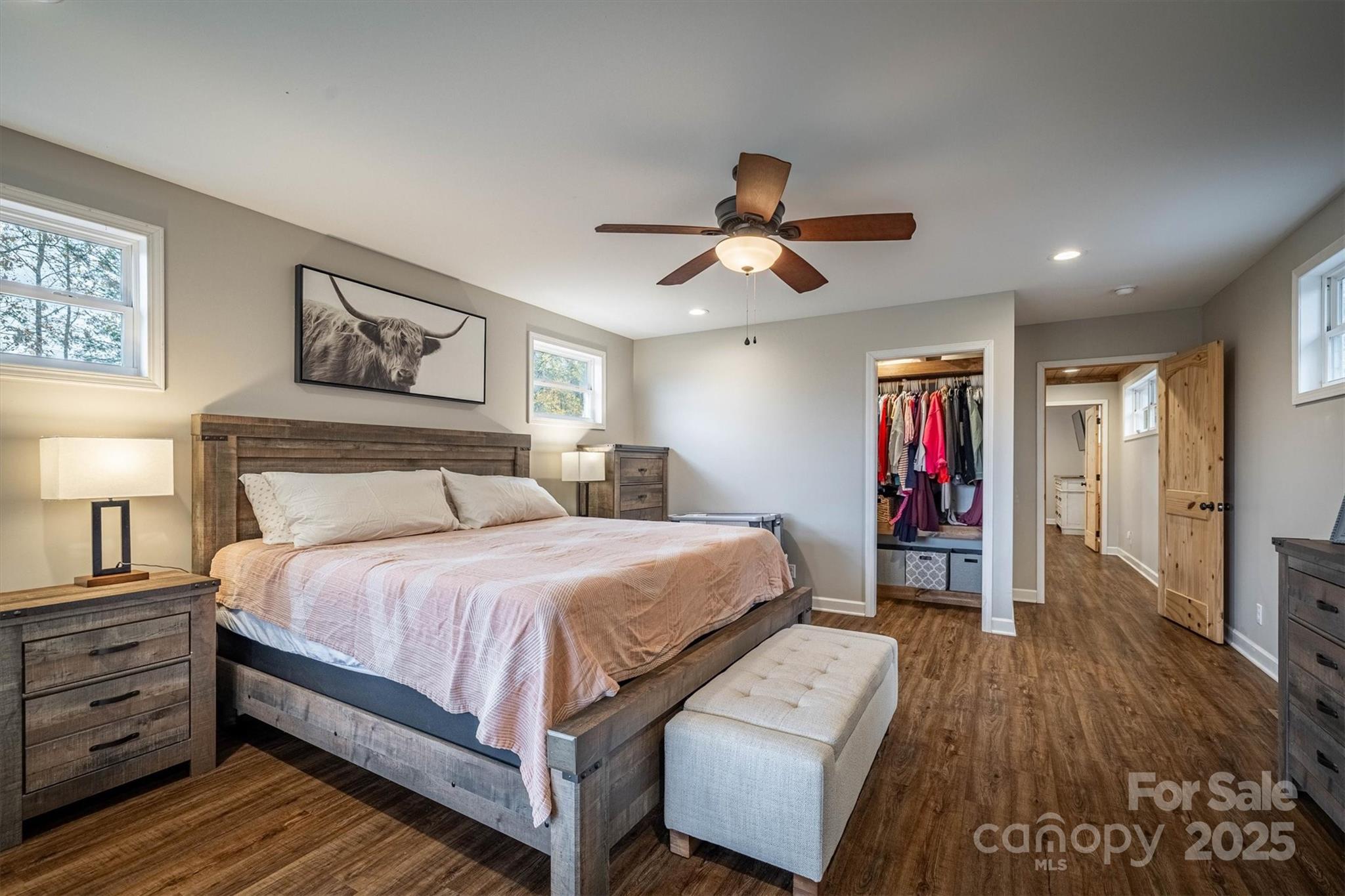 4447 Steeltown Road Lenoir, NC 28645 - Photo 36 of 42 a bedroom with a bed and a chandelier