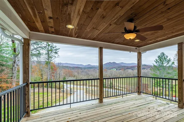 a view of a porch with wooden floor