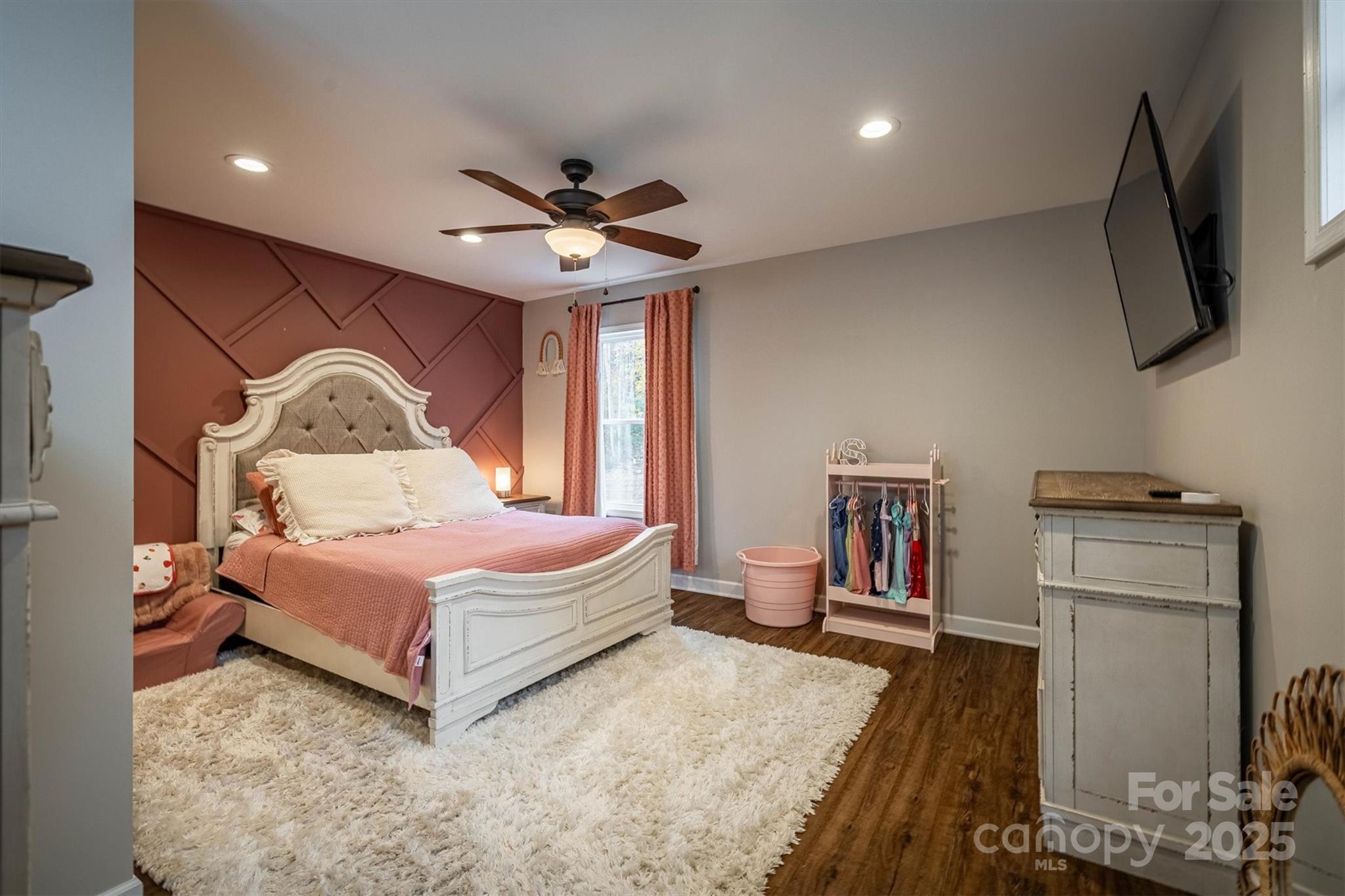 4447 Steeltown Road Lenoir, NC 28645 - Photo 41 of 42 a bedroom with a bed and a television