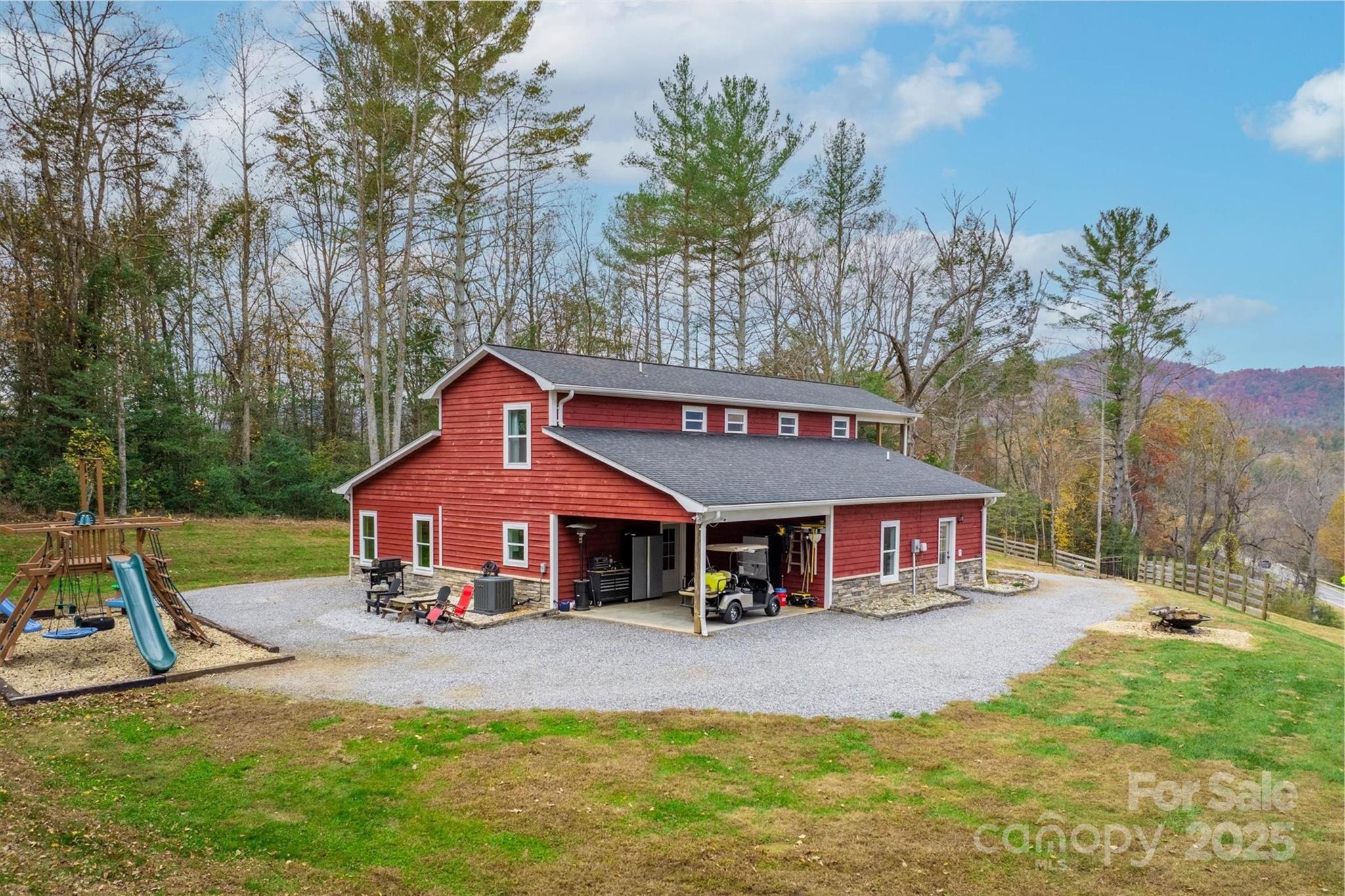 4447 Steeltown Road Lenoir, NC 28645 - Photo 5 of 42 a front view of a house with garden