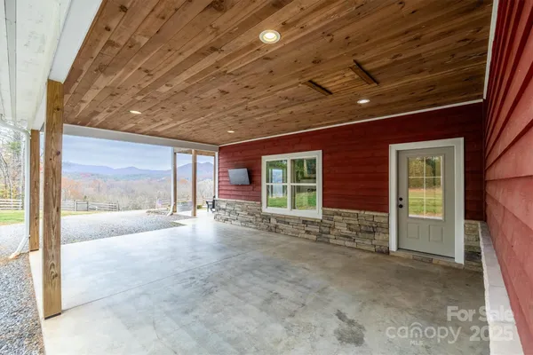 a view of an empty room with a fireplace