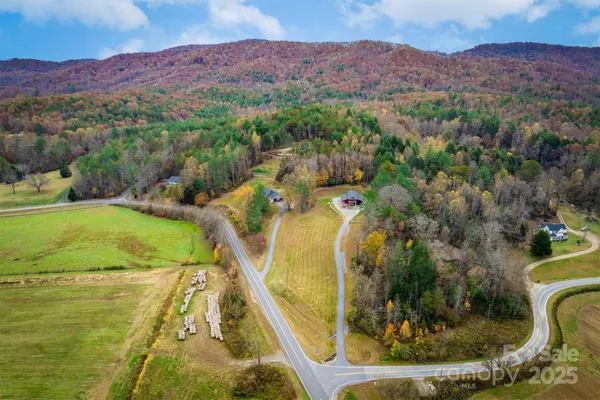 a view of a swimming pool with a yard