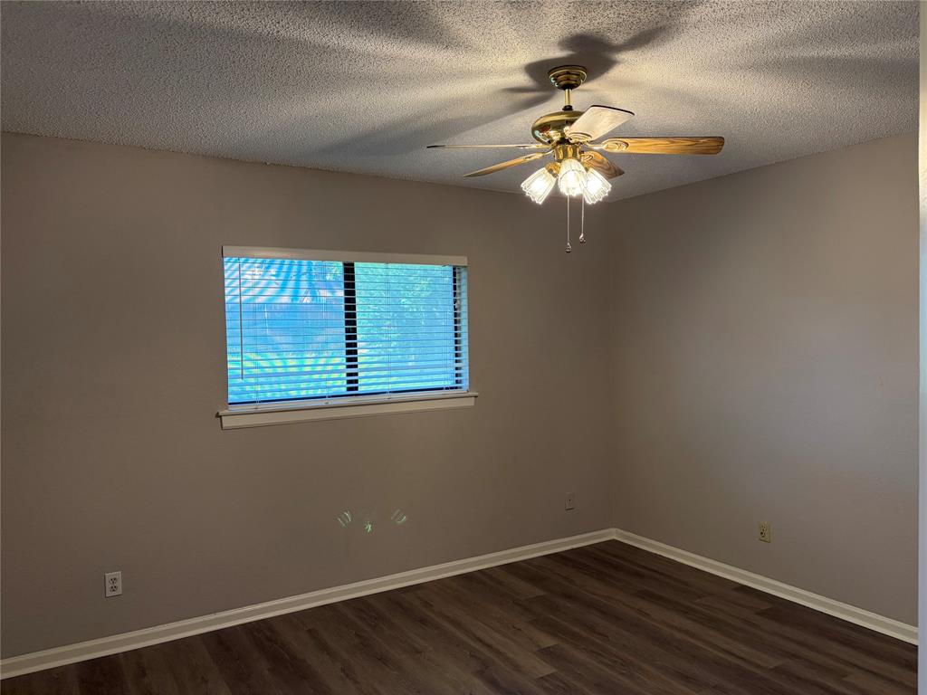 112 Cinnamon Lane Euless, TX 76039 - Photo 5 of 12 a view of a workspace with wooden floor and a window