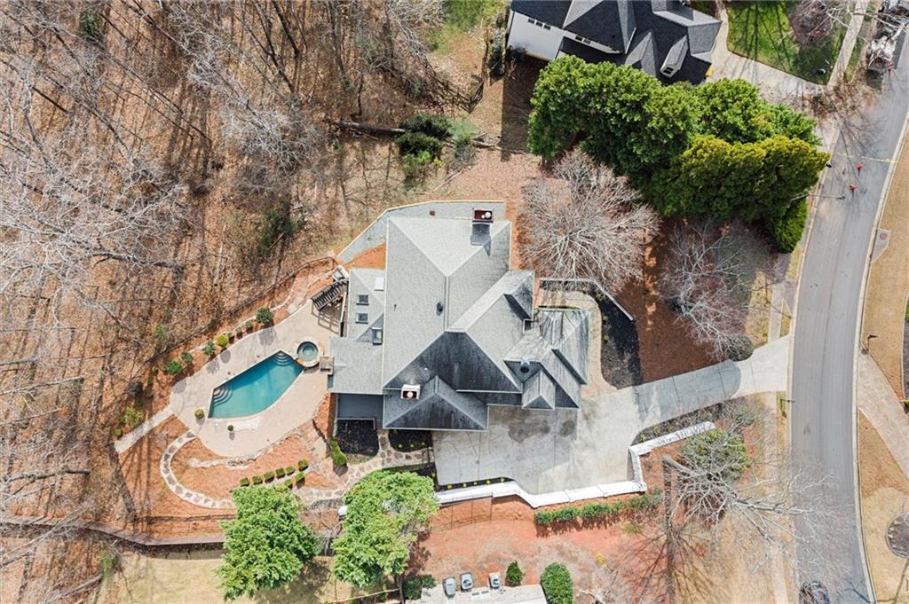 an aerial view of residential house with outdoor space and parking