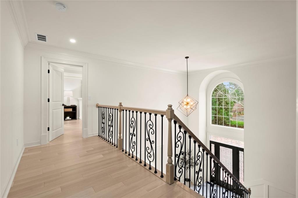 539 Schofield Drive Powder Springs, GA 30127 - Photo 16 of 41 a view of a hallway with windows and stairs