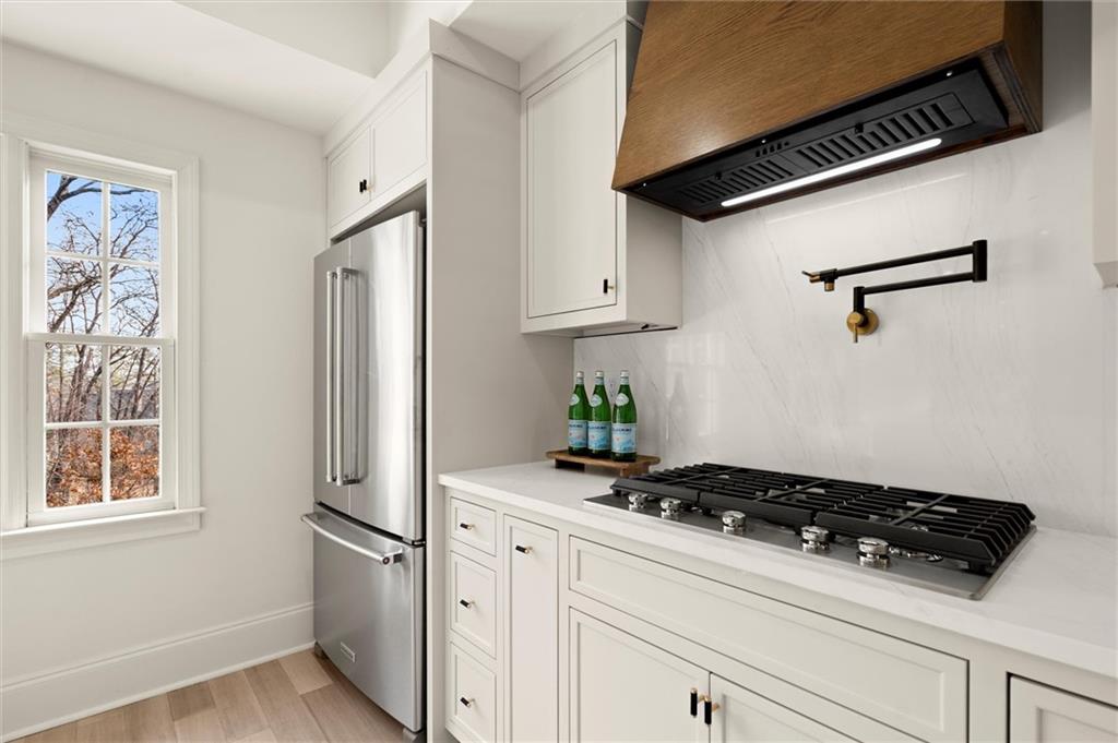 539 Schofield Drive Powder Springs, GA 30127 - Photo 8 of 41 a kitchen with stainless steel appliances a refrigerator and a stove