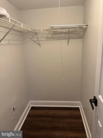 a view of a room with racks on the wall