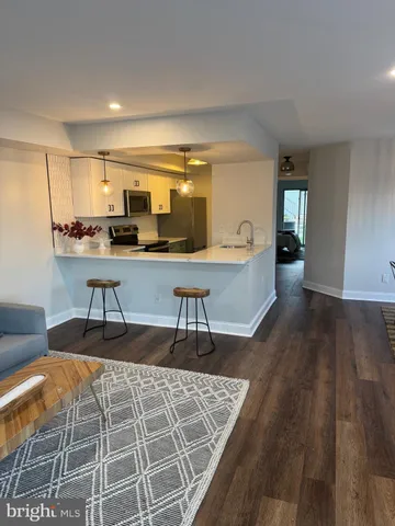 a living room with a couch and a table