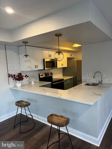 a kitchen with a table and chairs in it