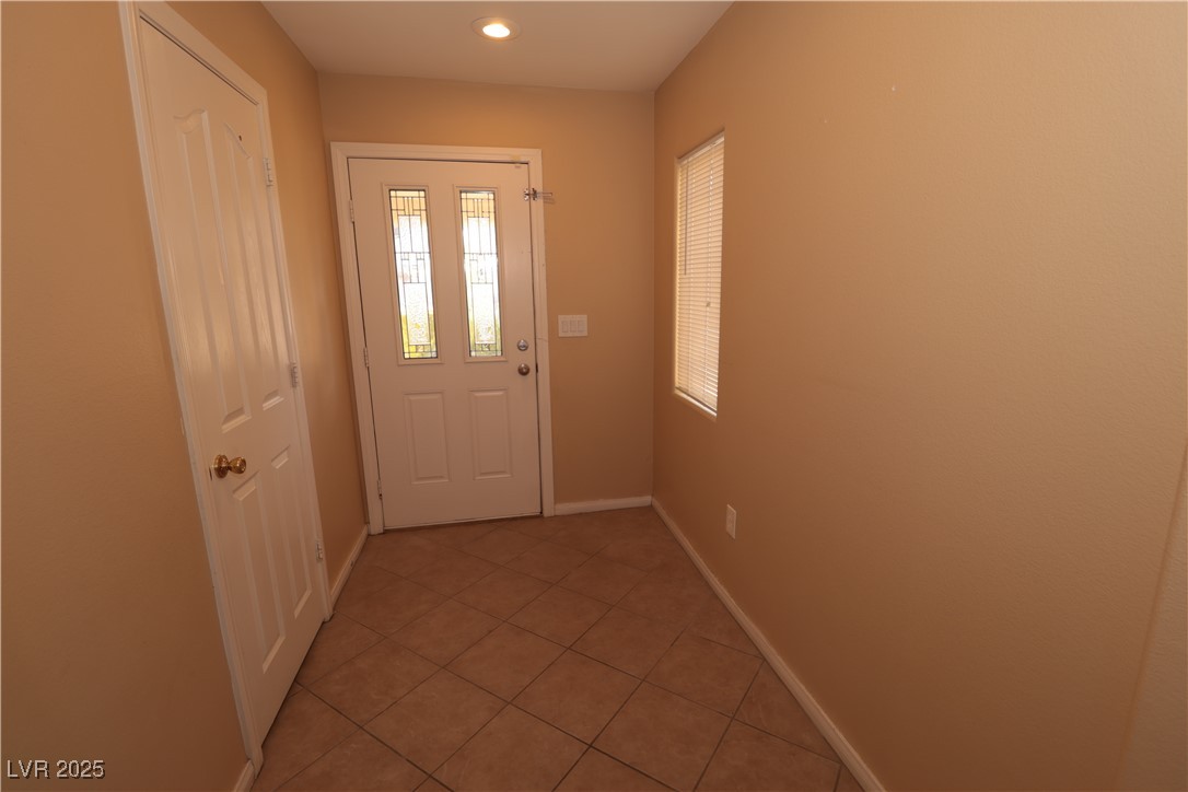 5940 Feral Garden Street North Las Vegas, NV 89031 - Photo 3 of 31 Doorway with tile patterned flooring and recessed lighting