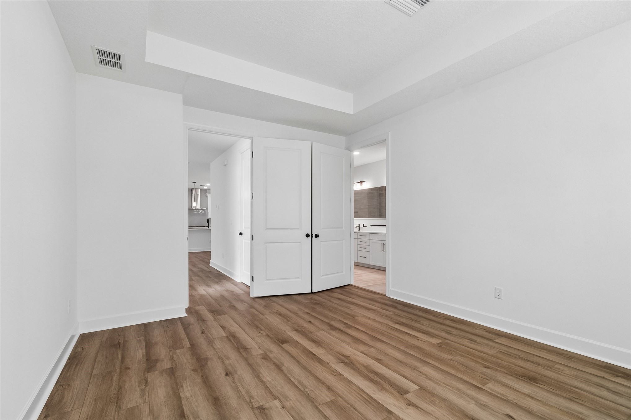 718 Windchime Street Yulee, FL 32097 - Photo 18 of 28 an empty room with wooden floor
