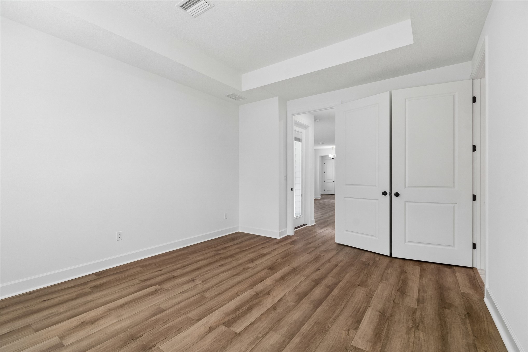 718 Windchime Street Yulee, FL 32097 - Photo 19 of 28 a view of a room with wooden floor