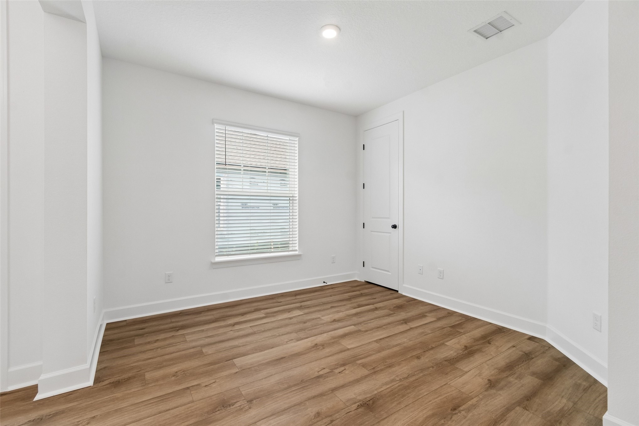 718 Windchime Street Yulee, FL 32097 - Photo 20 of 28 a view of empty room with wooden floor