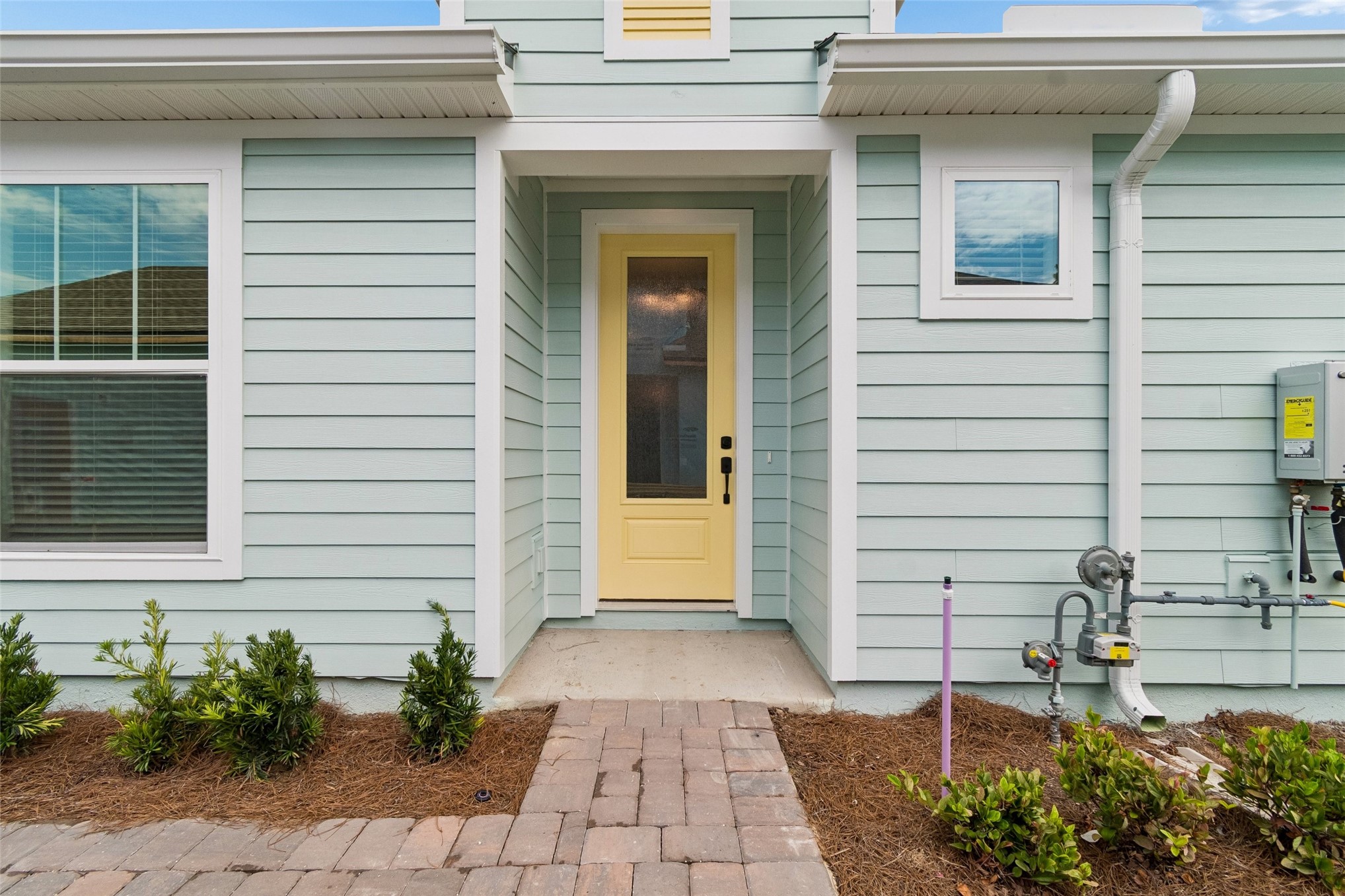 718 Windchime Street Yulee, FL 32097 - Photo 2 of 28 a front view of a house with garden
