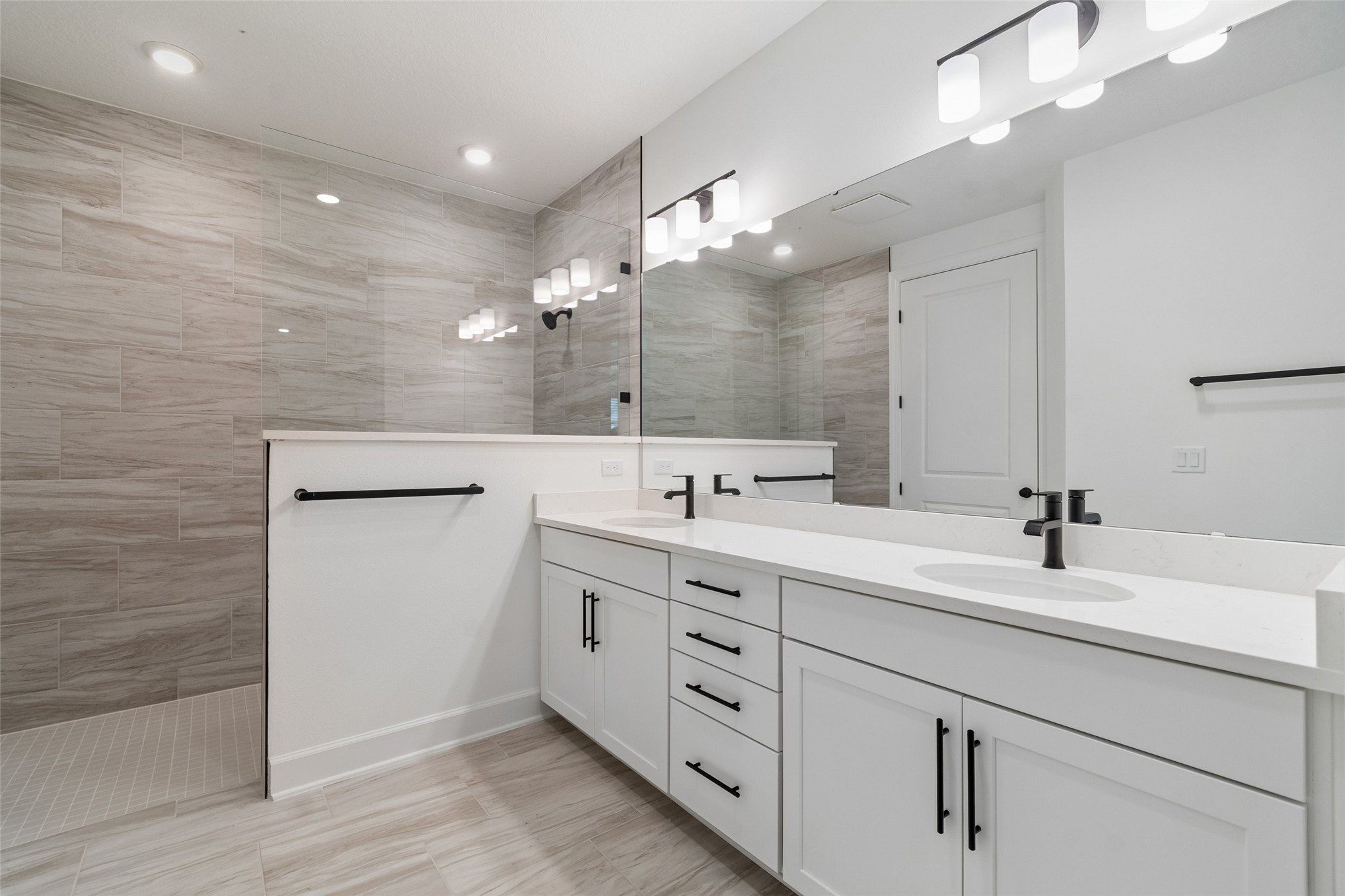 718 Windchime Street Yulee, FL 32097 - Photo 21 of 28 a spacious bathroom with a double vanity sink mirror and
