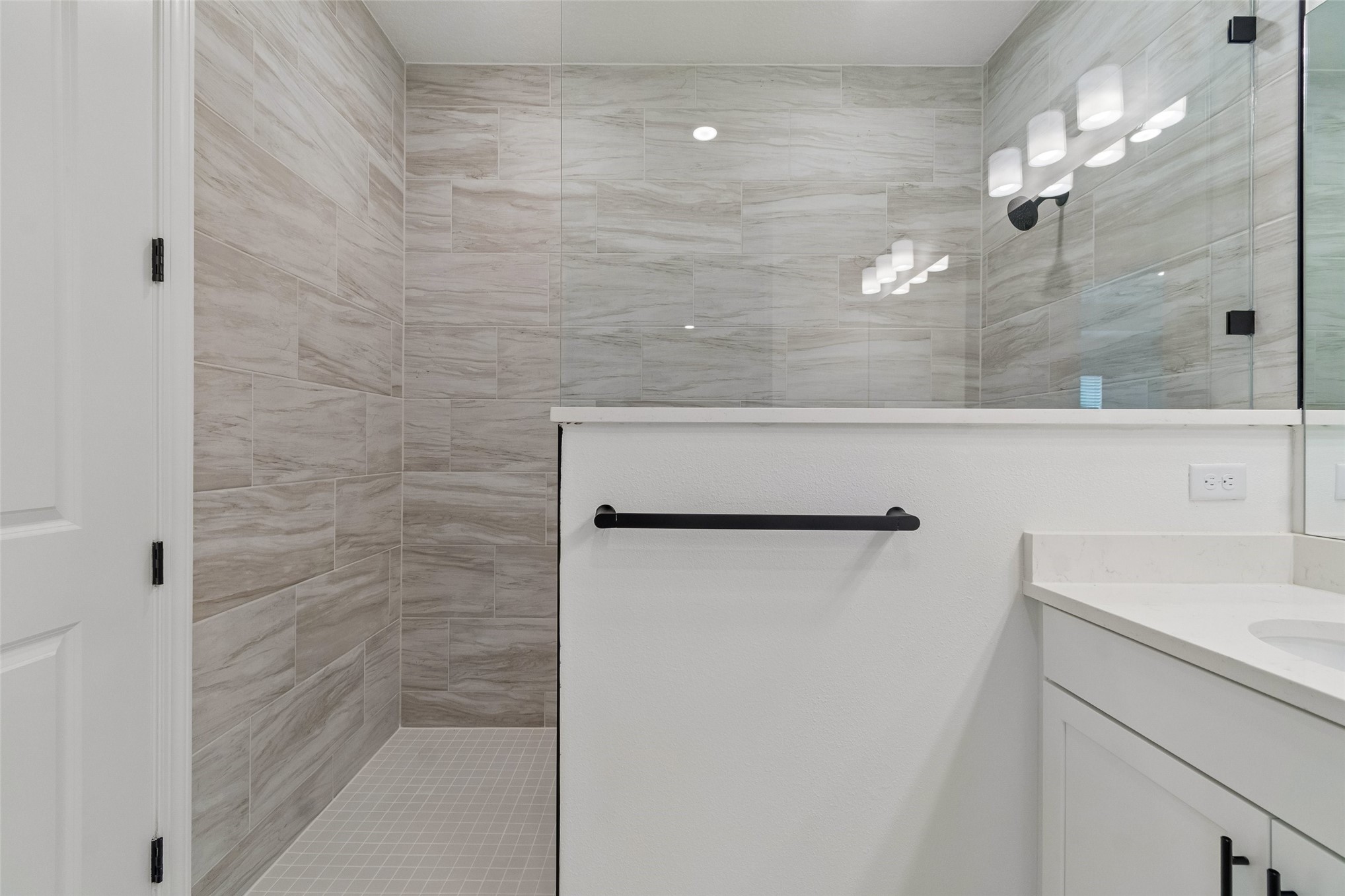 718 Windchime Street Yulee, FL 32097 - Photo 22 of 28 a bathroom with a shower and a sink