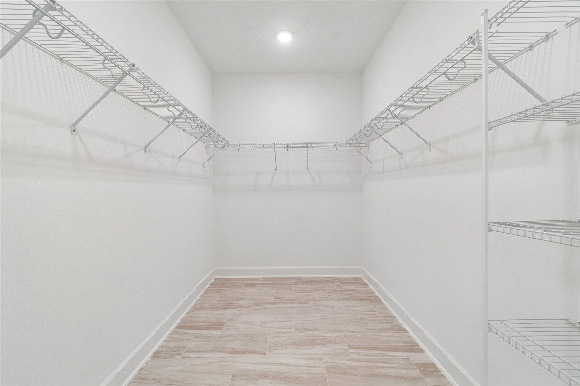 718 Windchime Street Yulee, FL 32097 - Photo 24 of 28 a view of a room with racks on the wall