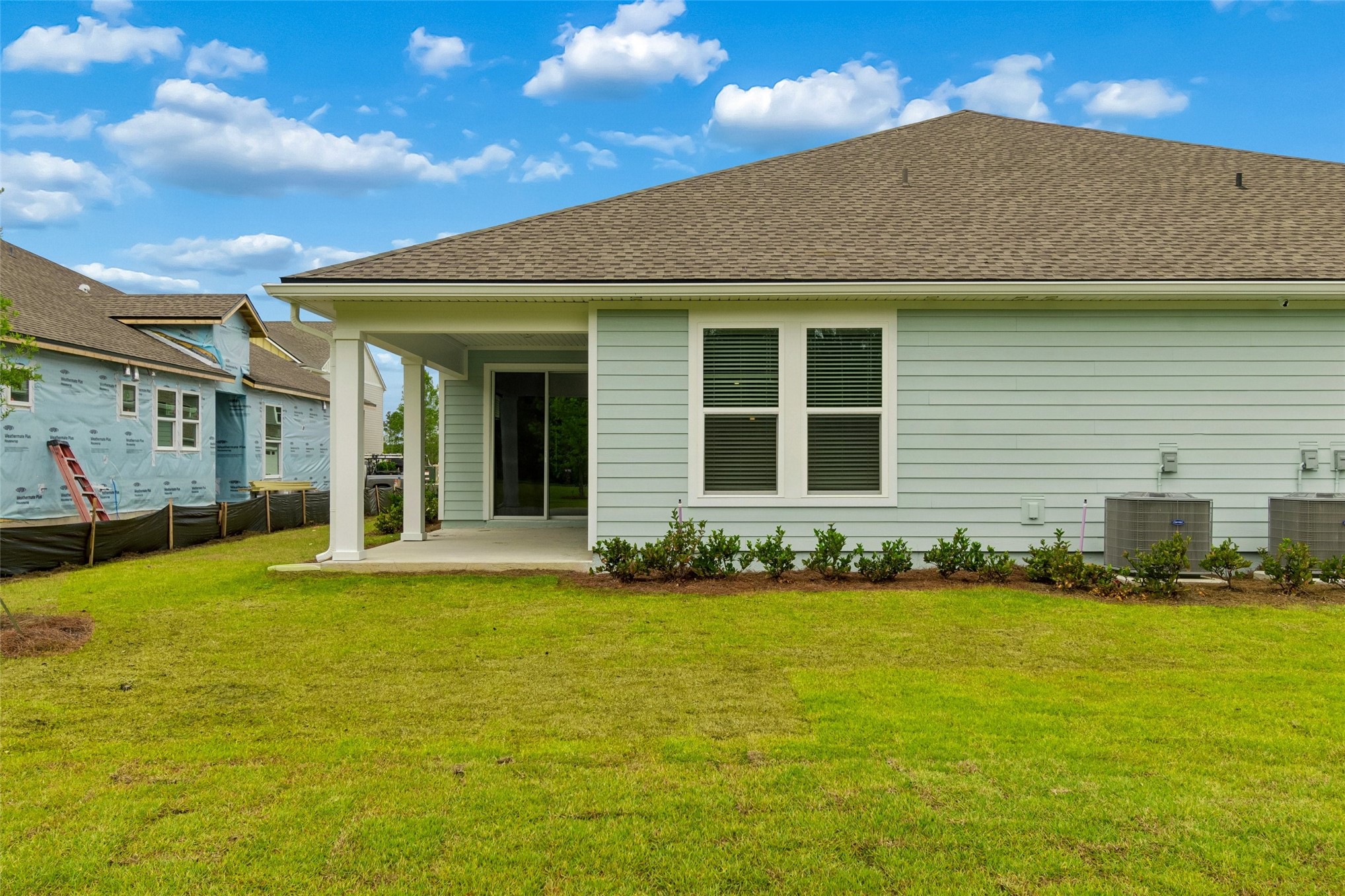 718 Windchime Street Yulee, FL 32097 - Photo 28 of 28 a view of a house with a yard