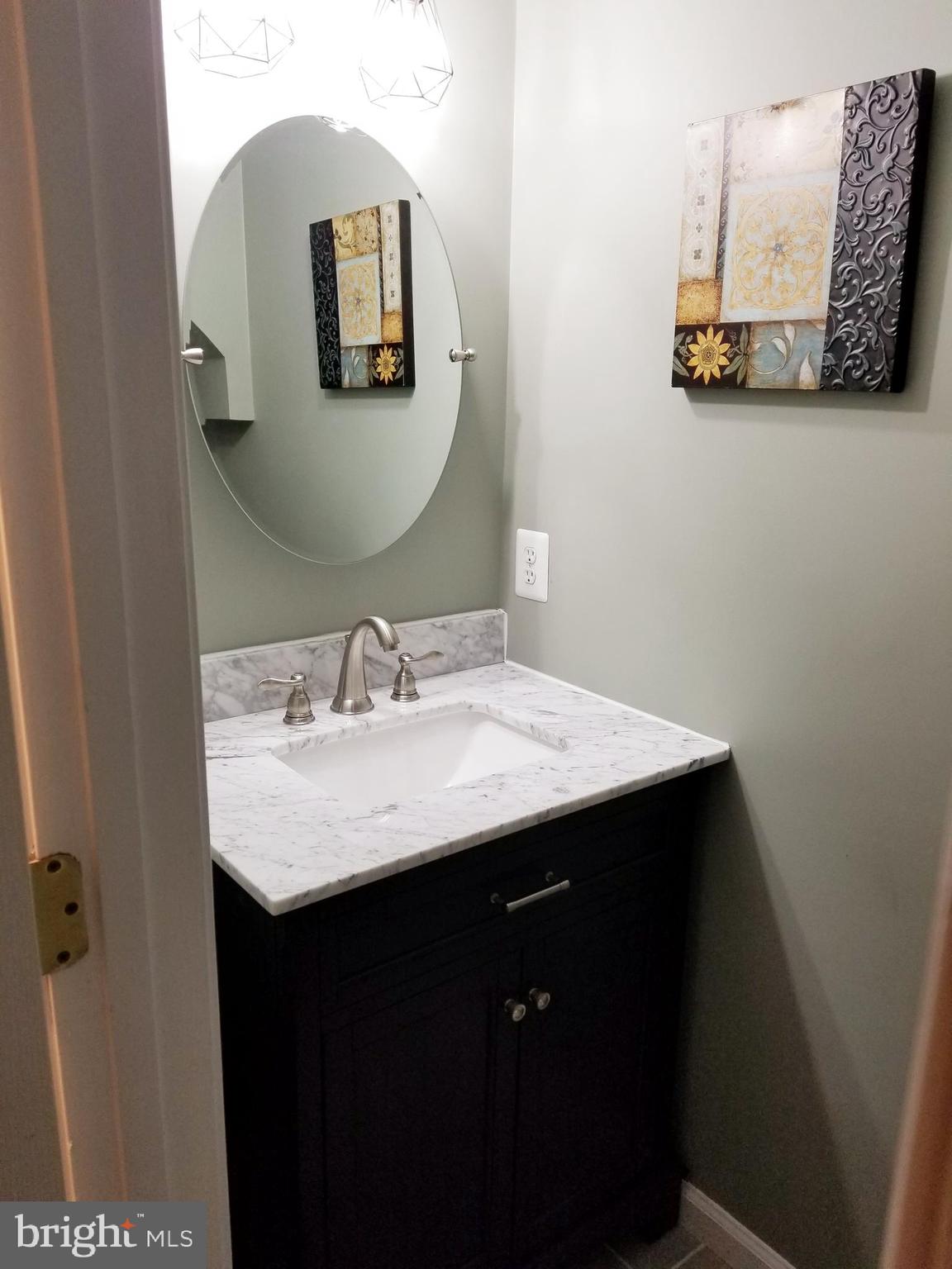 12233 Fletchertown Road Bowie, MD 20720 - Photo 30 of 33 Very nice powder room on this level for guest