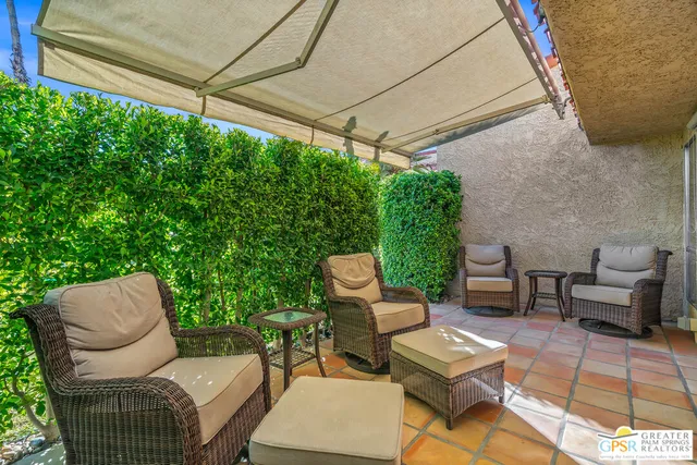 a outdoor living space with furniture and a potted plant