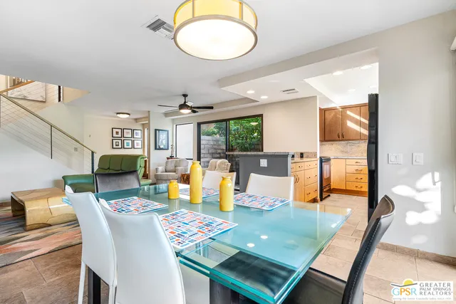 a living room with kitchen island furniture and a large window