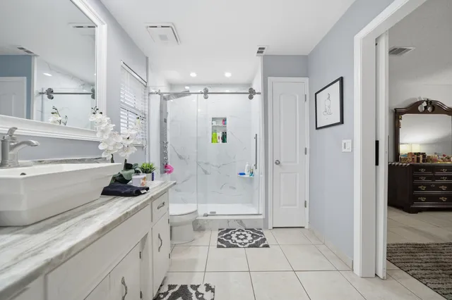 a kitchen with cabinets and window