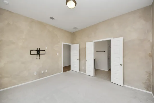 a view of a big room with closet and cabinet