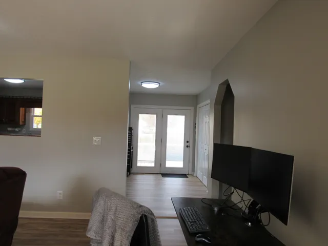 a view of a livingroom with furniture and a flat screen tv