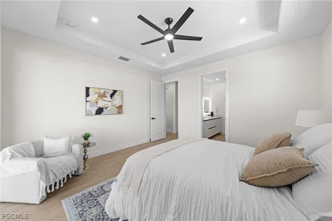 a bedroom with a bed and a couch