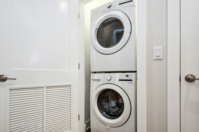 a view of a hallway with washer and dryer