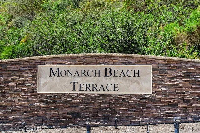 a view of outdoor space with a garden and trees