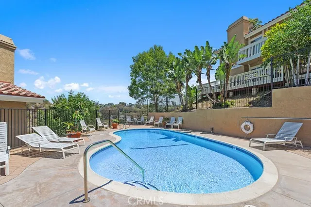 a view of a swimming pool with a lounge chairs