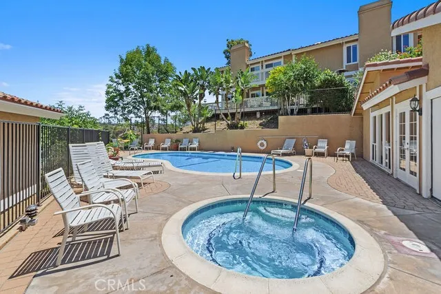 swimming pool view with a outdoor seating