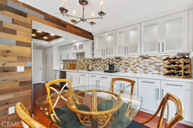 a kitchen with stainless steel appliances granite countertop a sink and cabinets