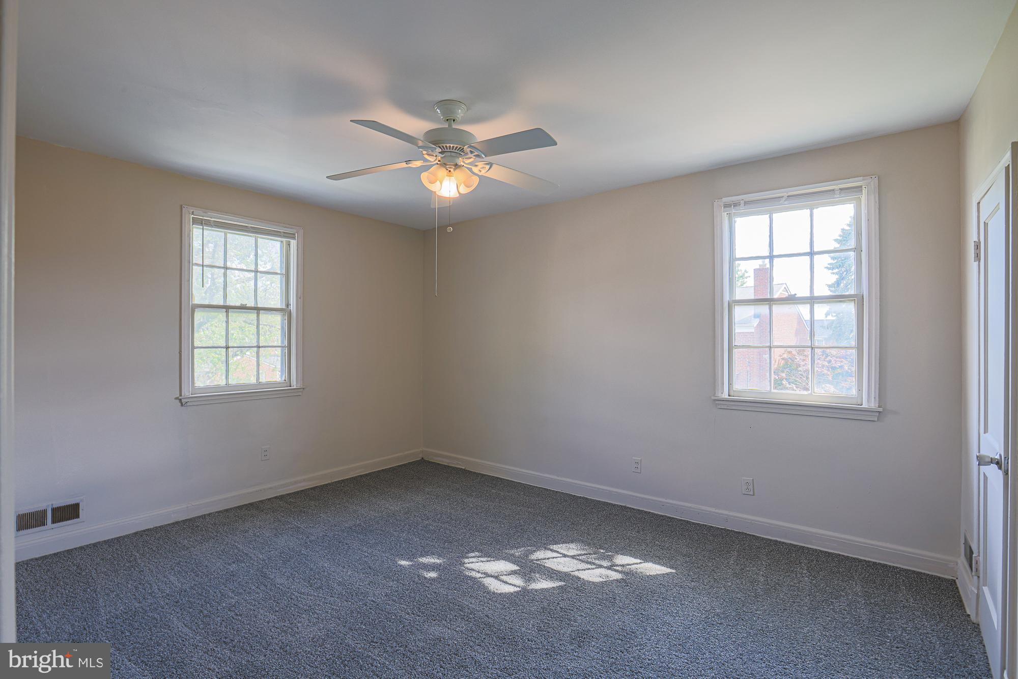 3914 Bancroft Road Baltimore, MD 21215 - Photo 14 of 25 an empty room with a window and ceiling fan