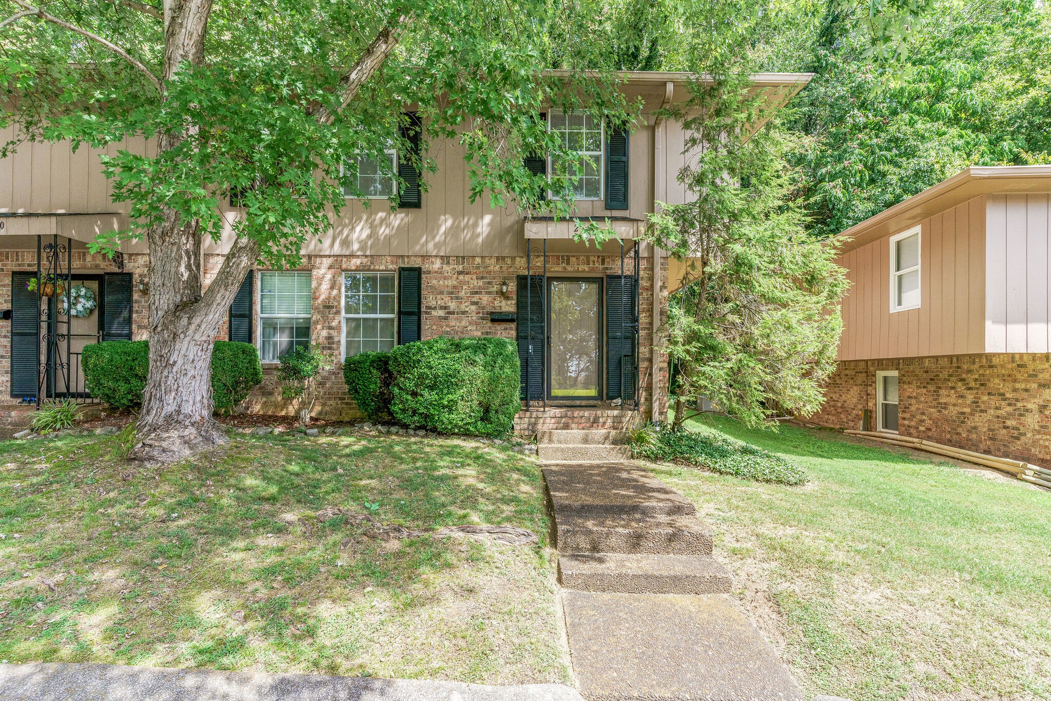 a front view of a house with garden
