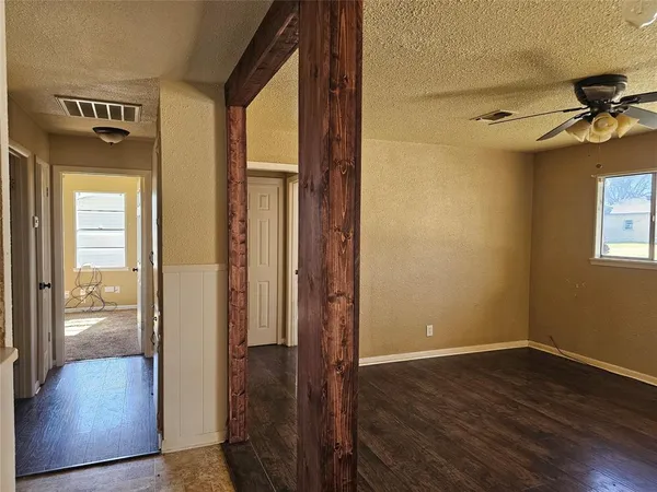 a view of hallway with wooden floor