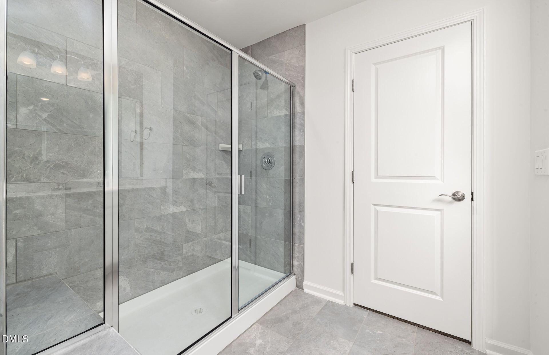 5021 Reader Way Durham, NC 27703 - Photo 14 of 32 a bathroom with a glass shower door