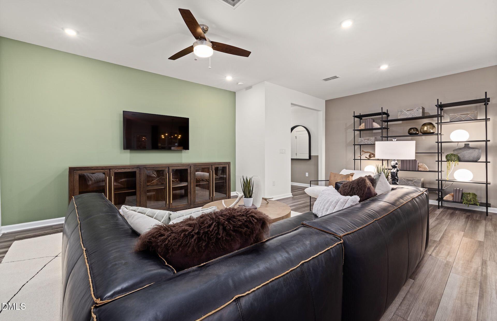 5021 Reader Way Durham, NC 27703 - Photo 6 of 32 a living room with furniture and a flat screen tv