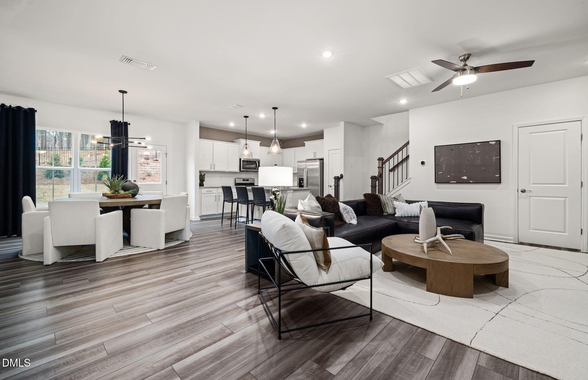 5021 Reader Way Durham, NC 27703 - Photo 8 of 32 a living room with furniture a fireplace and a flat screen tv