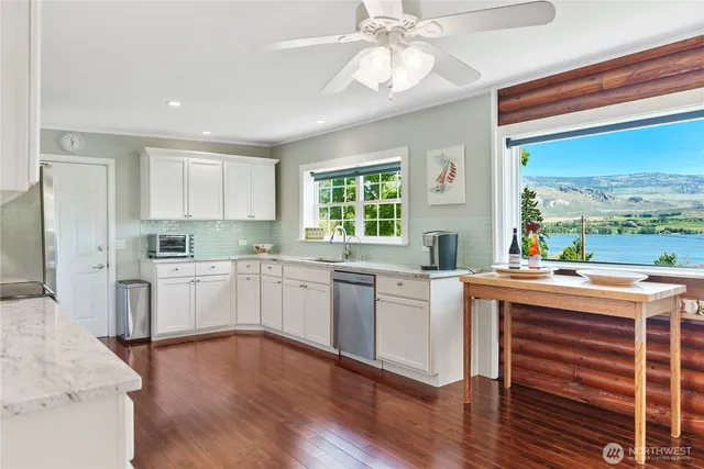 a kitchen with a stove a sink and a refrigerator