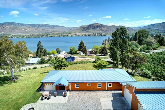 a view of a swimming pool with a yard