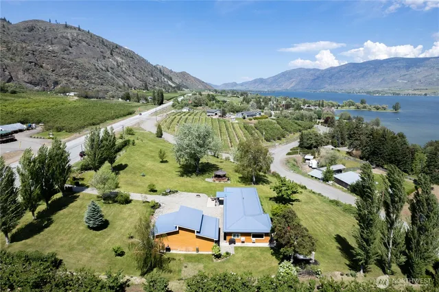 an aerial view of a house with mountain view