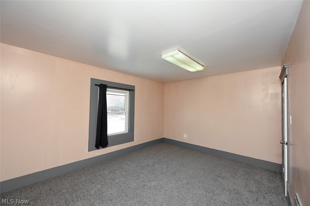 868 North Main Street Akron, OH 44310 - Photo 14 of 30 Carpeted spare room with baseboards