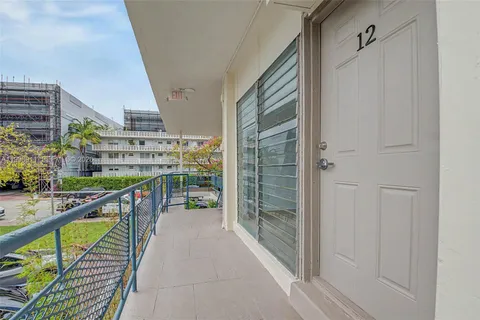 a view of balcony with wooden floor
