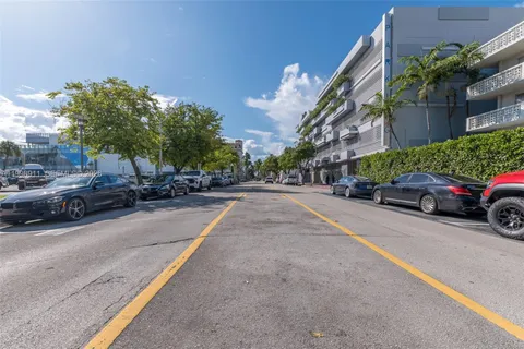 a view of a street with a tree