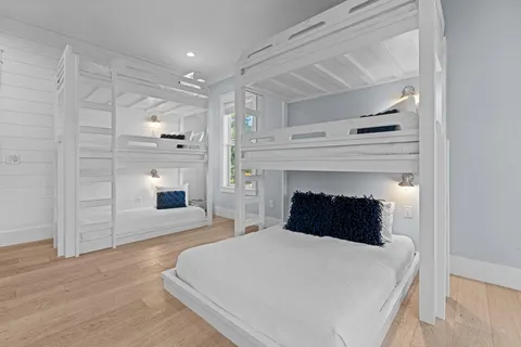 a bedroom with a bed and a fireplace