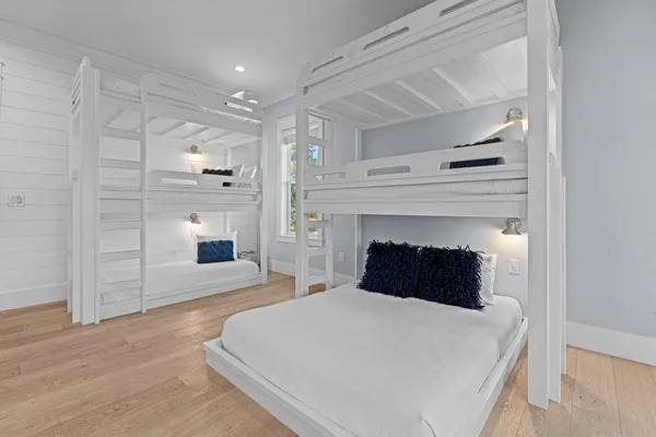 a bedroom with a bed and a fireplace