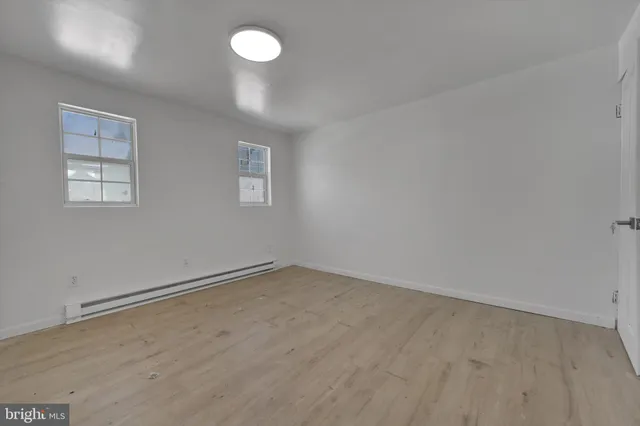 an empty room with a empty space and window