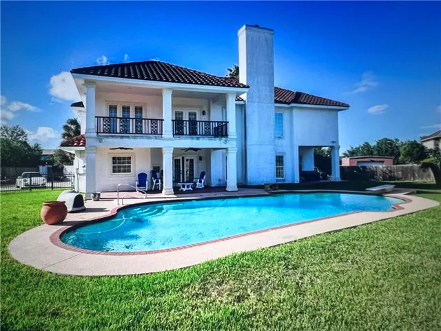 a view of a house with a swimming pool